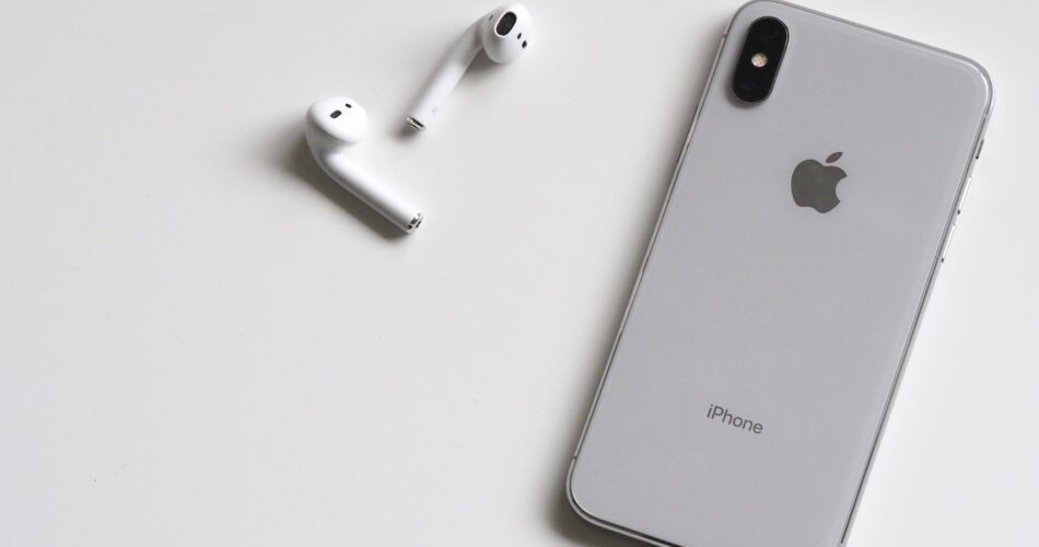 silver iphone x with airpods