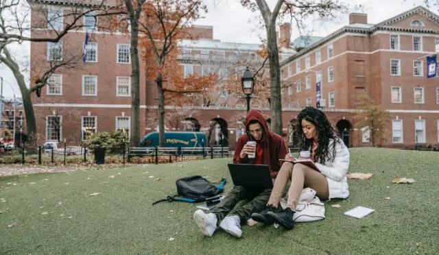 man and woman studying at a park